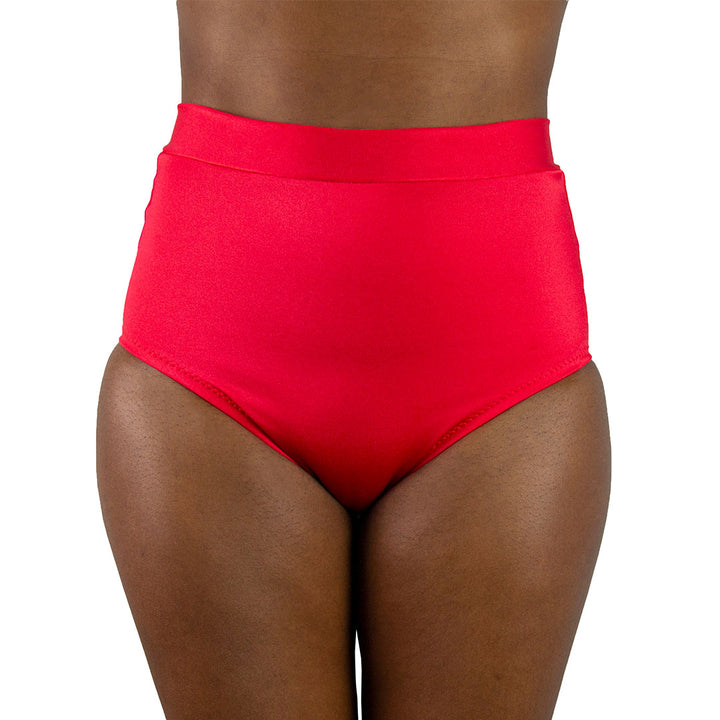 Digital sewing pattern featuring a retro high-waisted bikini bottom with moderate leg openings and full back coverage. Includes four view options and is modelled in red with a matching halter top. Format includes A4, US Letter, and A0. Sizes XS–XL. Video tutorial included.